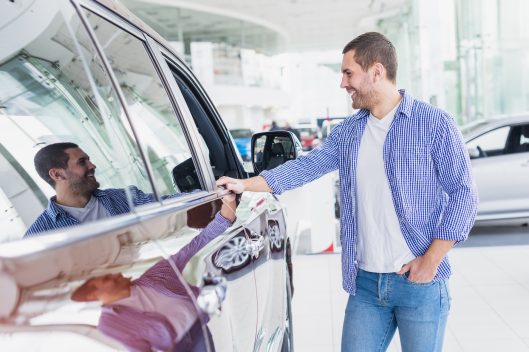 happy-man-car-dealership